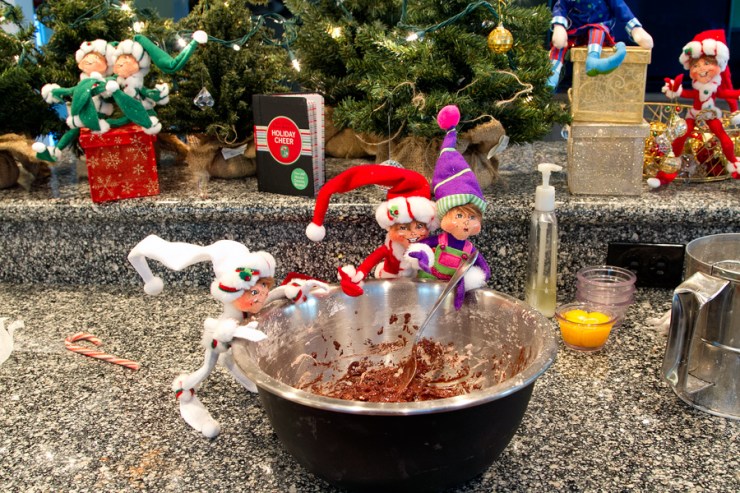 Edmond helps the new elf (who is rather short for his age)