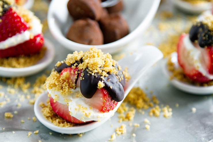 a spoonful of Cheesecake Stuffed Strawberries with Chocolate Ganache 