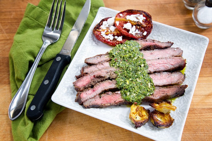 Flank Steak with Chimichurri sauce, roasted artichokes and roasted tomatoes with goat cheese