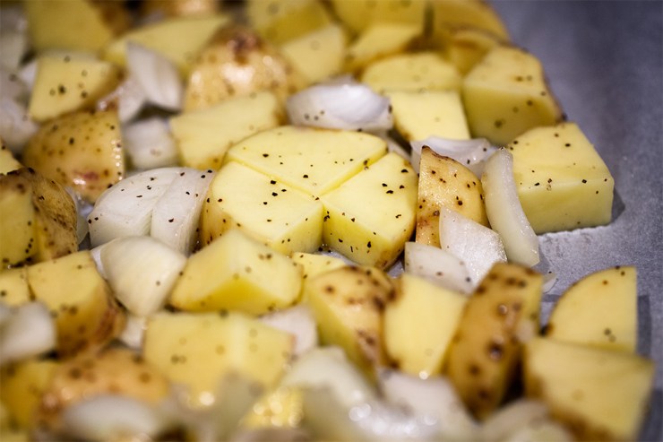 Potatoes, seasoned and ready to be roasted