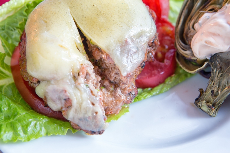 Butter melts into burger leaving herbs inside for a juicy and flavorful burger